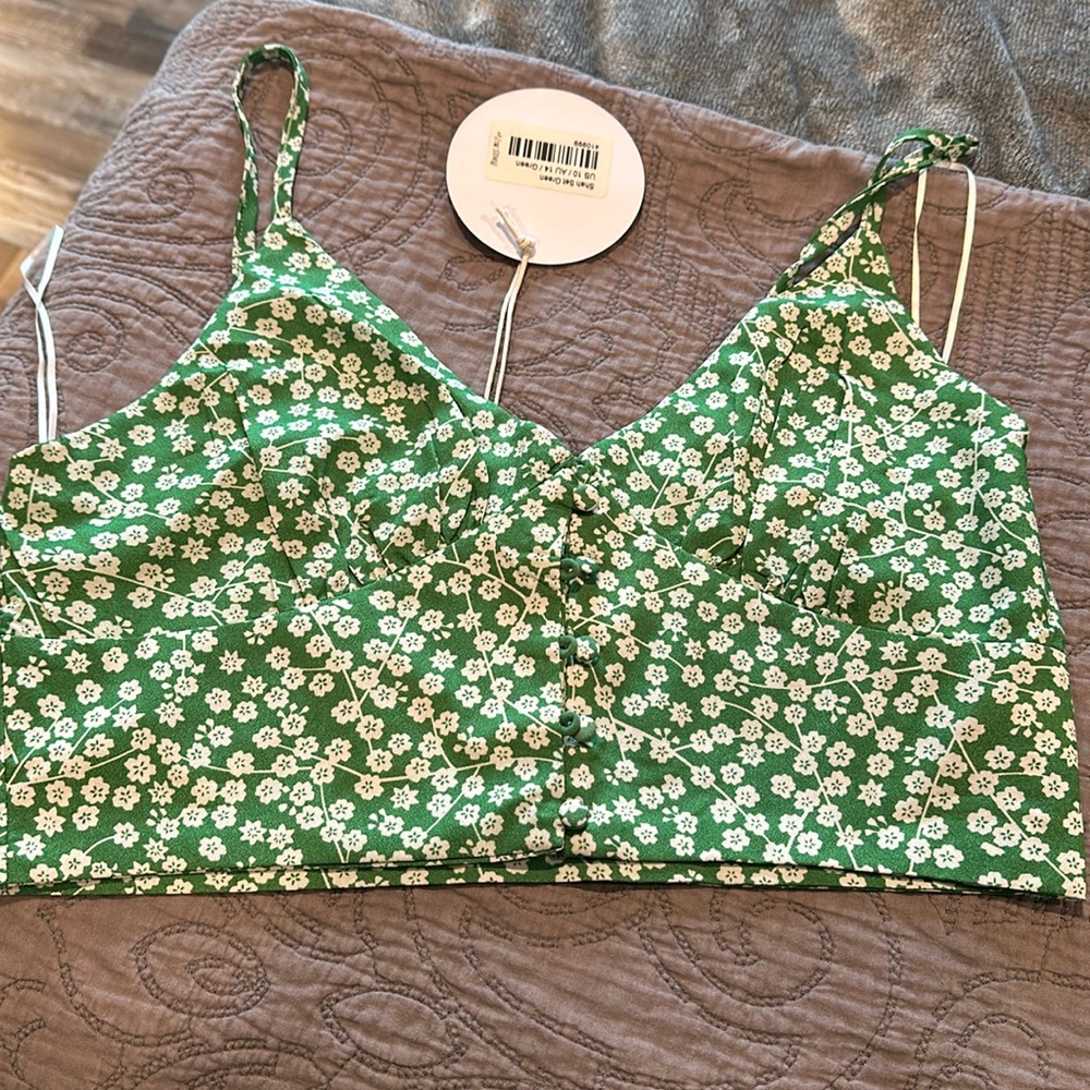 Green floral 2 piece set.  Skirt and strap top. New with tags, size 10.